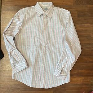 Plaid, red and blue striped pattern, long sleeve button up collared shirt